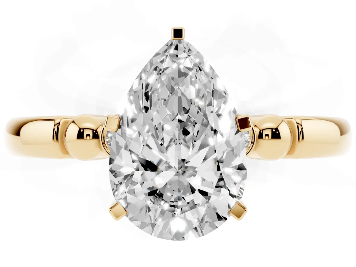 Pear Cut Solitaire Beaded Band with Four-Prong Setting Yellow gold
