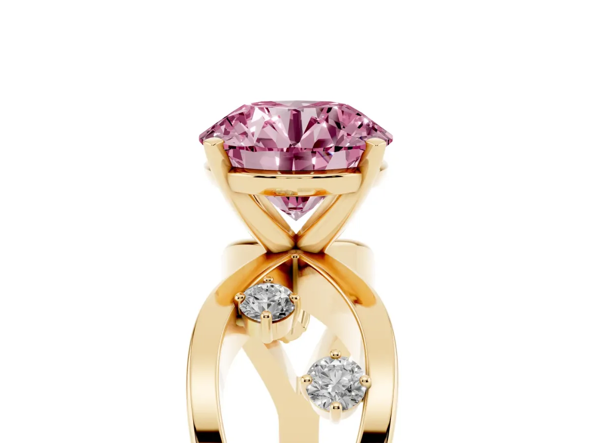 Fancy Pink Round Cut Cut Solitaire Diamond with Side Stones on Criss-Cross Band and Four-Prong Setting Yellow gold