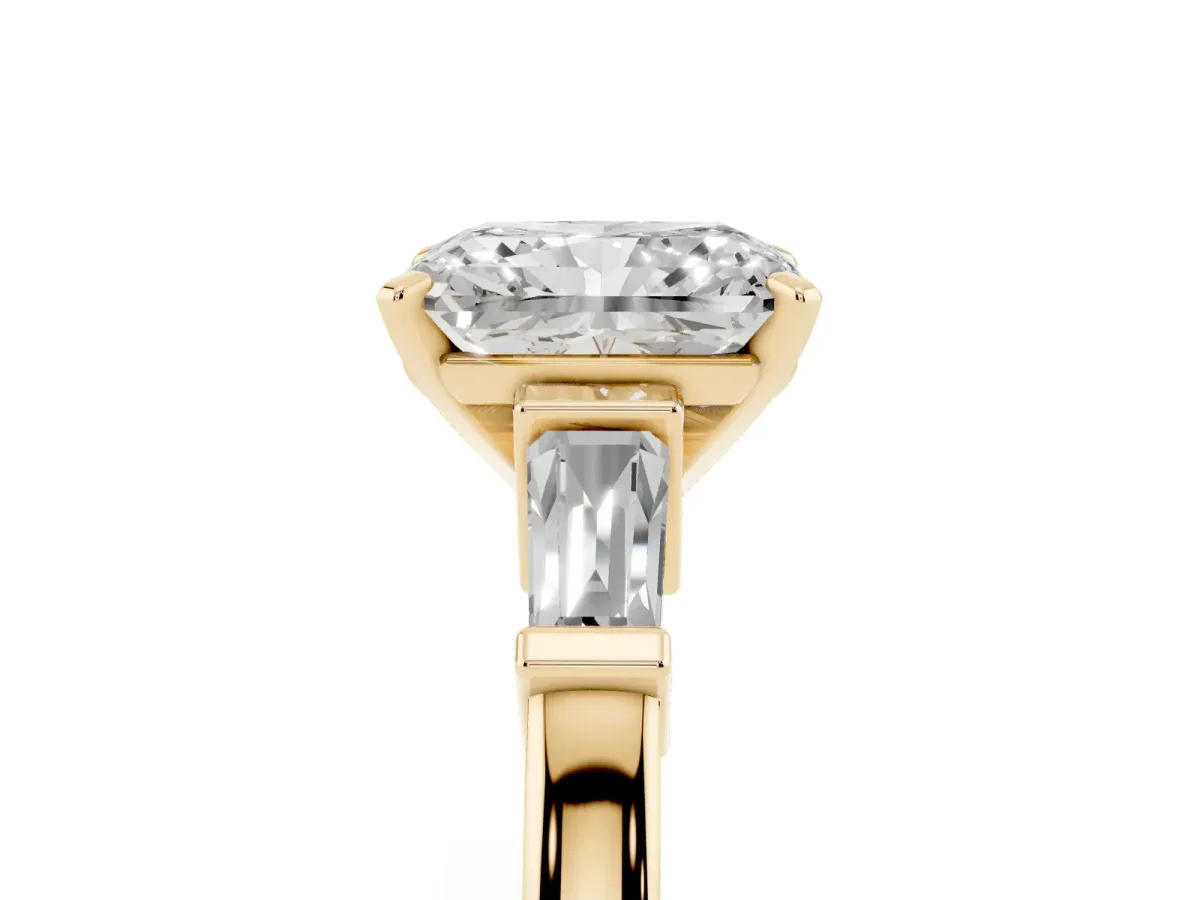 Radiant Cut Cut Diamond Solitaire Ring with Tapered Baguette Accents and Four-Prong Setting Yellow gold