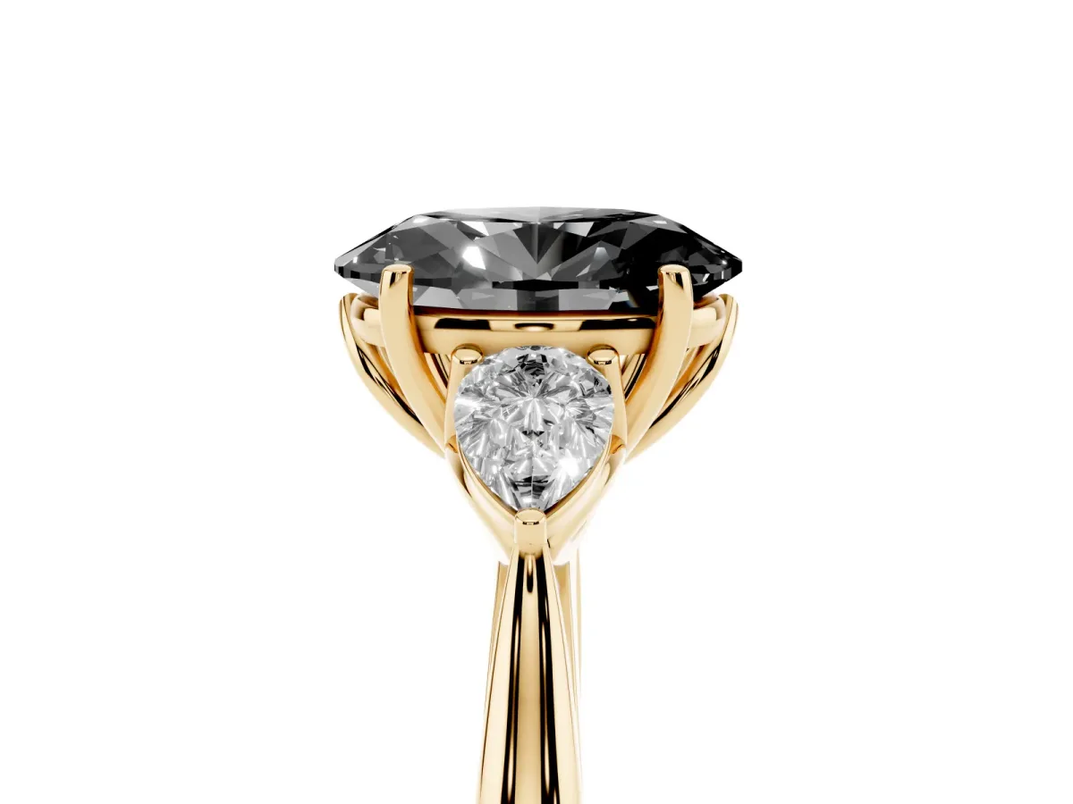 Fancy Black Oval Cut Diamond Three-Stone Ring with Pear Side Stones and Prong Setting Yellow gold