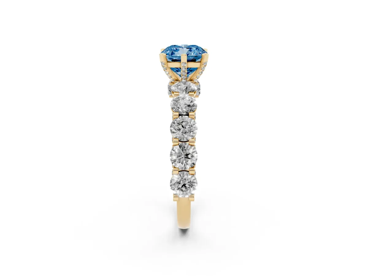 Fancy Blue Cushion Cut Diamond Side Stone Engagement Ring with Four-Prong Setting Yellow gold