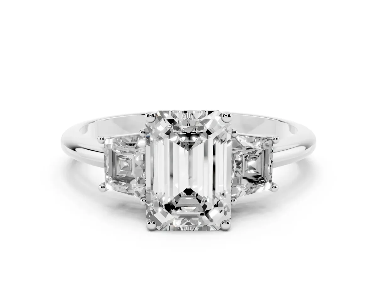 Emerald Cut Diamond Three-Stone Ring with Trapezoid Side Stones and Prong Setting Silver