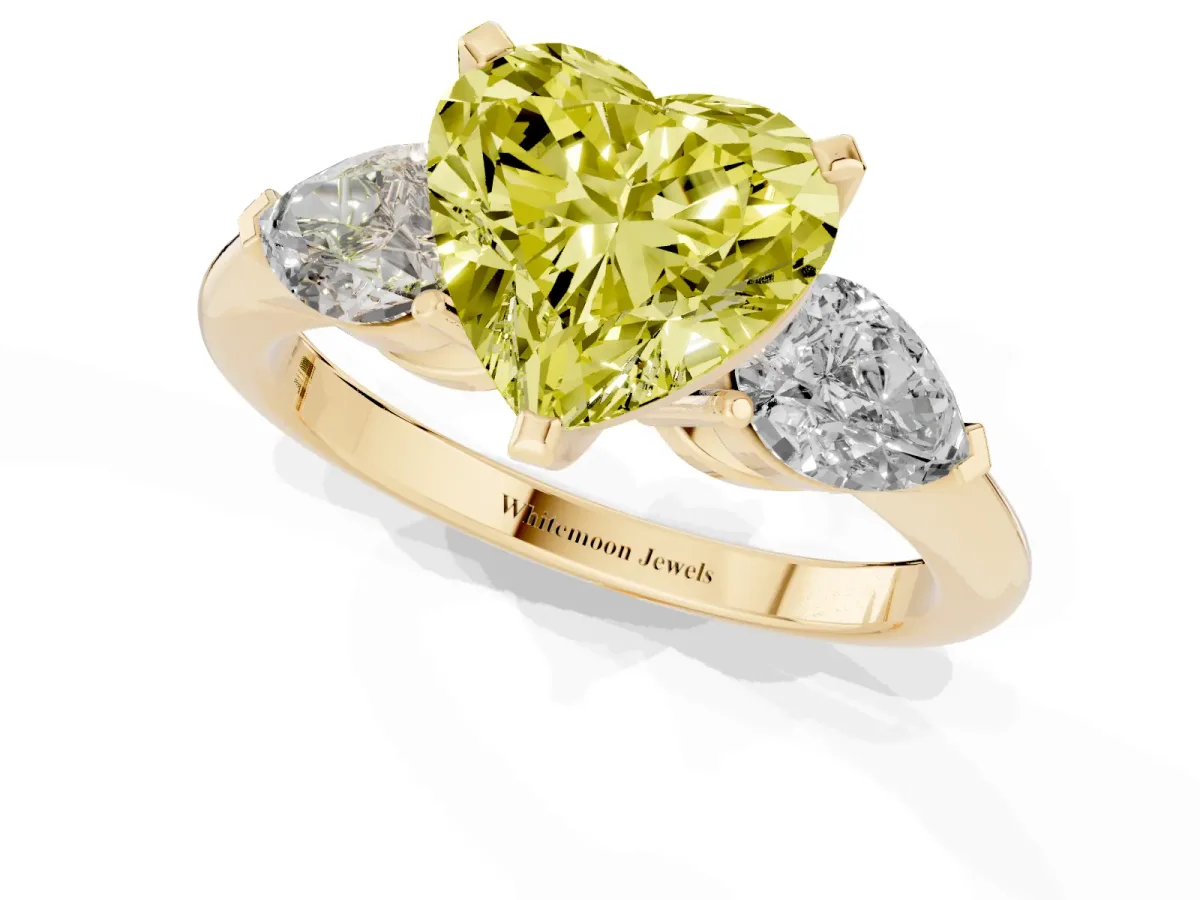 Fancy Yellow Three-Stone Heart Cut Diamond Ring with Pear Side Stones and Four-Prong Setting Yellow gold