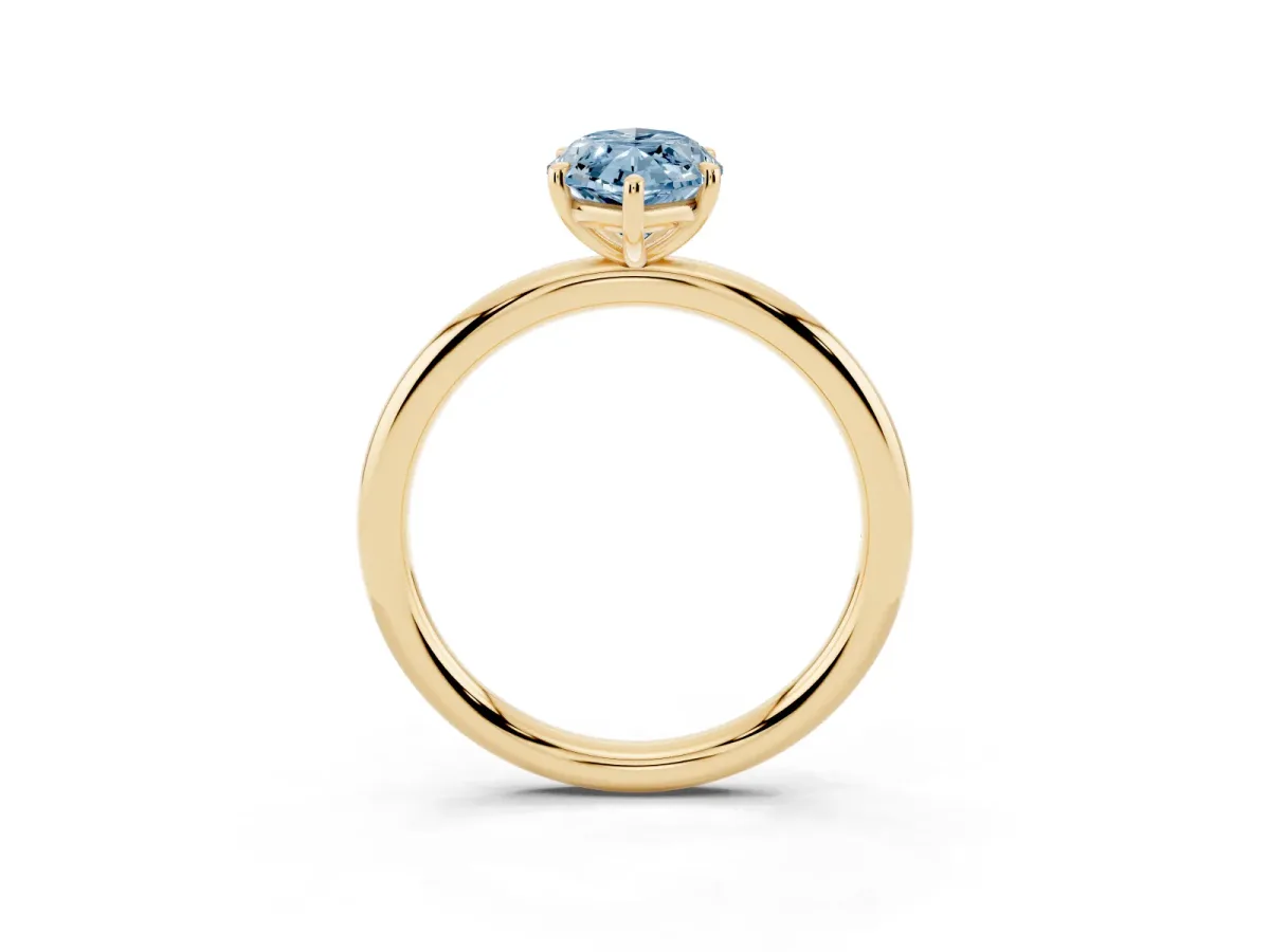 Fancy Blue Oval Cut Solitaire Diamond Ring with Four-Prong Setting on a Plain Band Yellow gold
