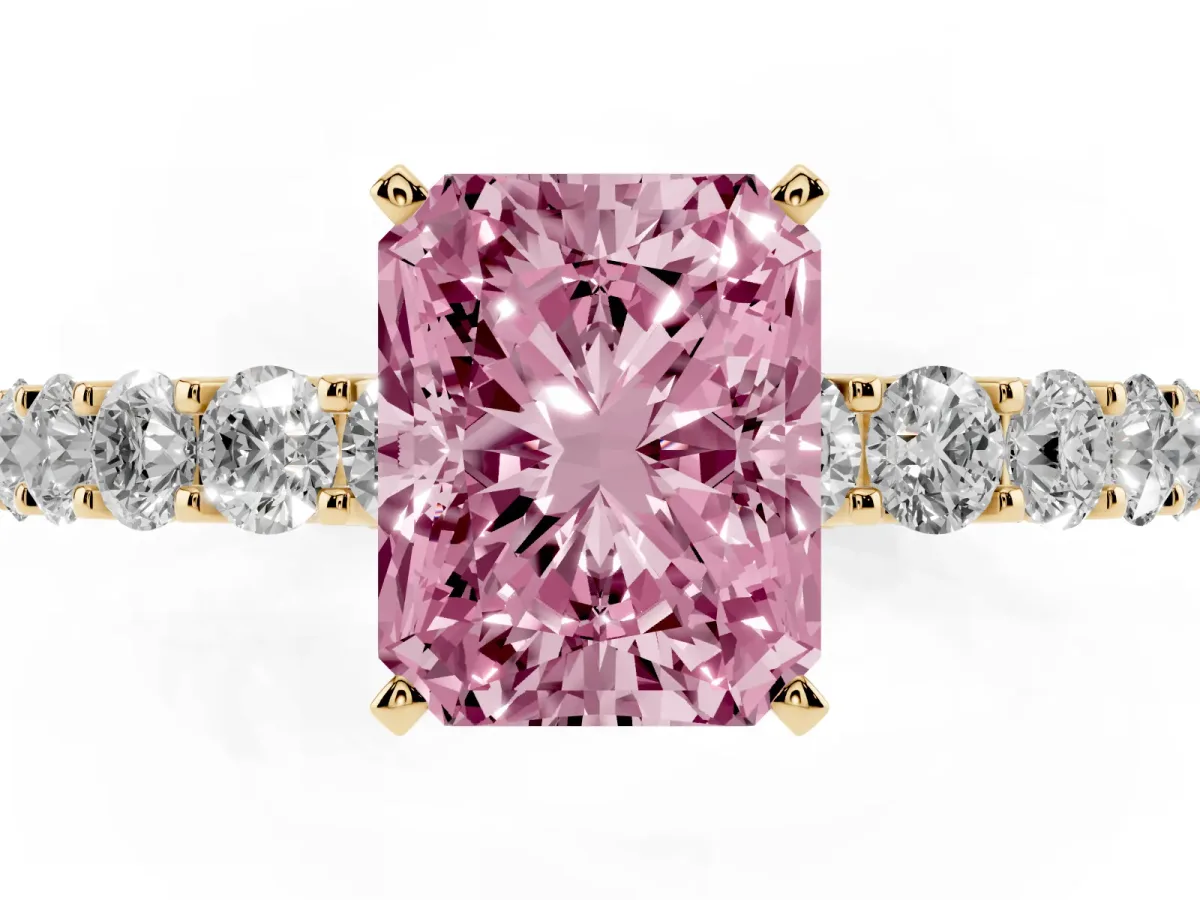 Fancy Pink Radiant Cut Diamond Solitaire Ring with Shared Prong Pavé Band and Four-Prong Setting Yellow gold