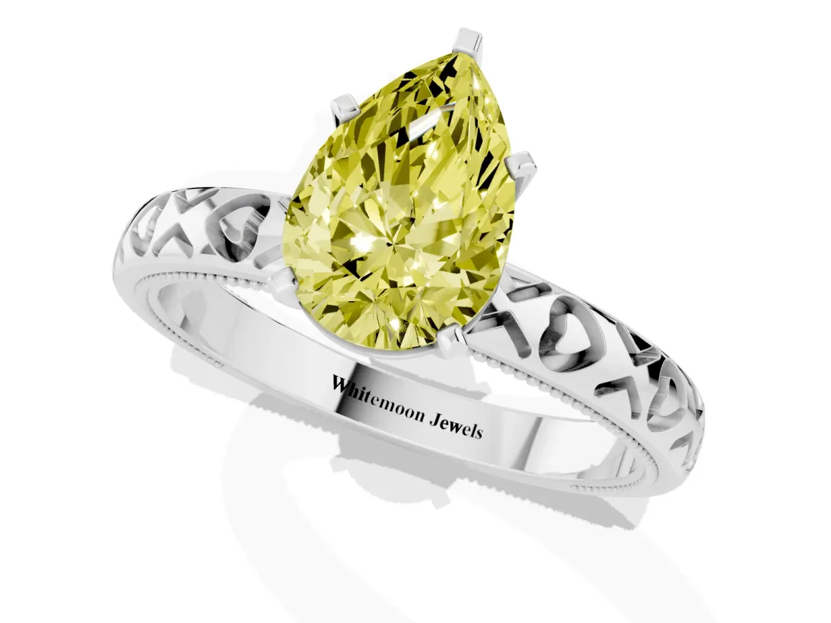 Fancy Yellow Pear Cut Solitaire Diamond Engagement Ring with XO Engraved Band and Four-Prong Setting Silver