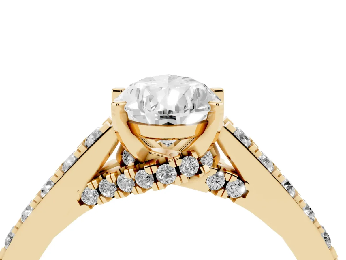 Pear Cut Diamond Solitaire Ring with Crossover Gallery and Round Pavé Band Yellow gold