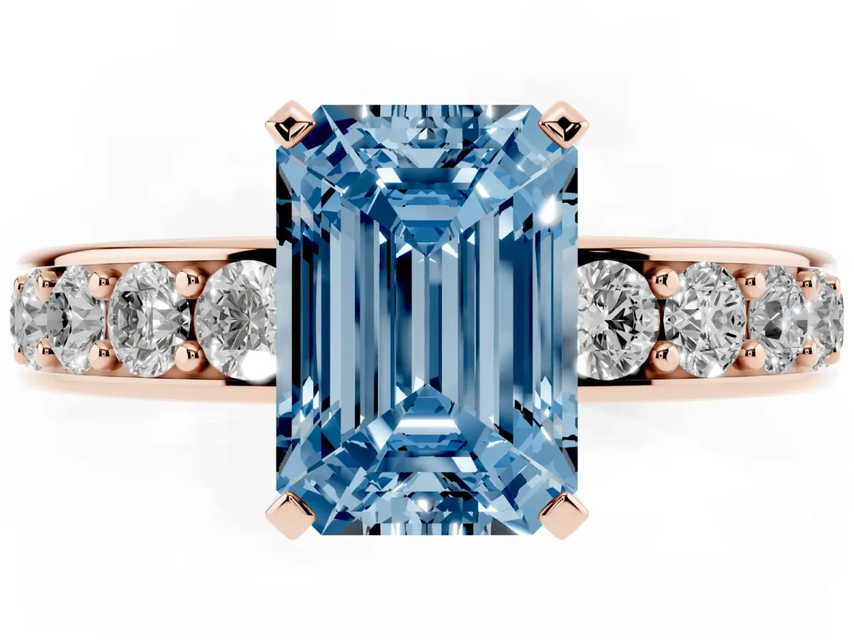 Fancy Blue Emerald Cut Diamond Engagement Ring with Channel Set Round Band and Prong Setting Rose gold