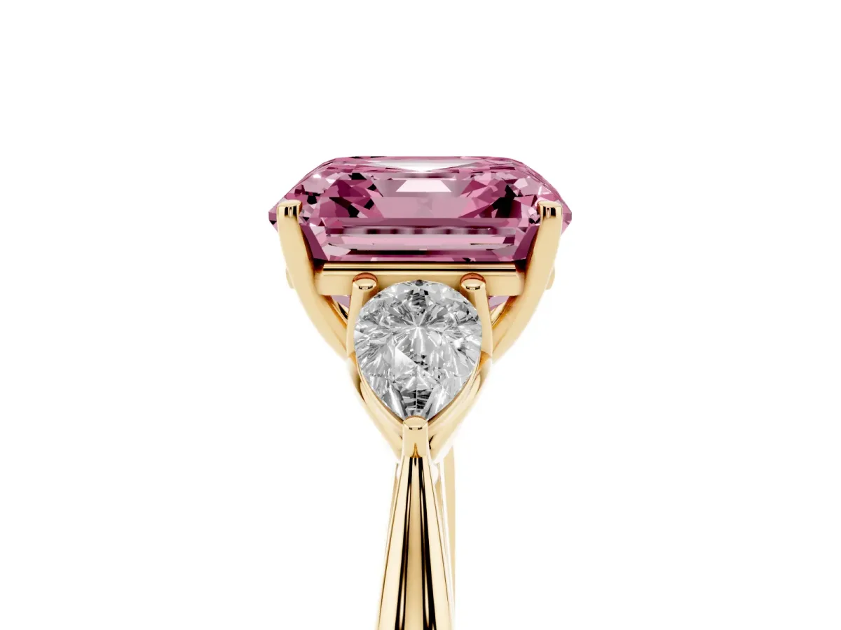 Fancy Pink Three-Stone Asscher Cut Diamond Ring with Pear Side Stones in Four-Prong Setting Yellow gold