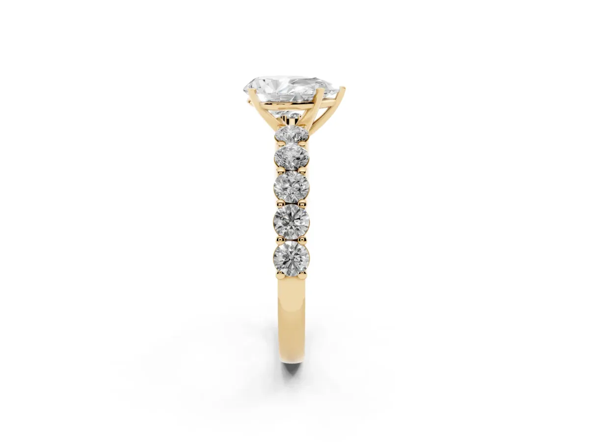 Pear Cut Diamond Solitaire Ring with Shared Prong Round Side Stones Yellow gold
