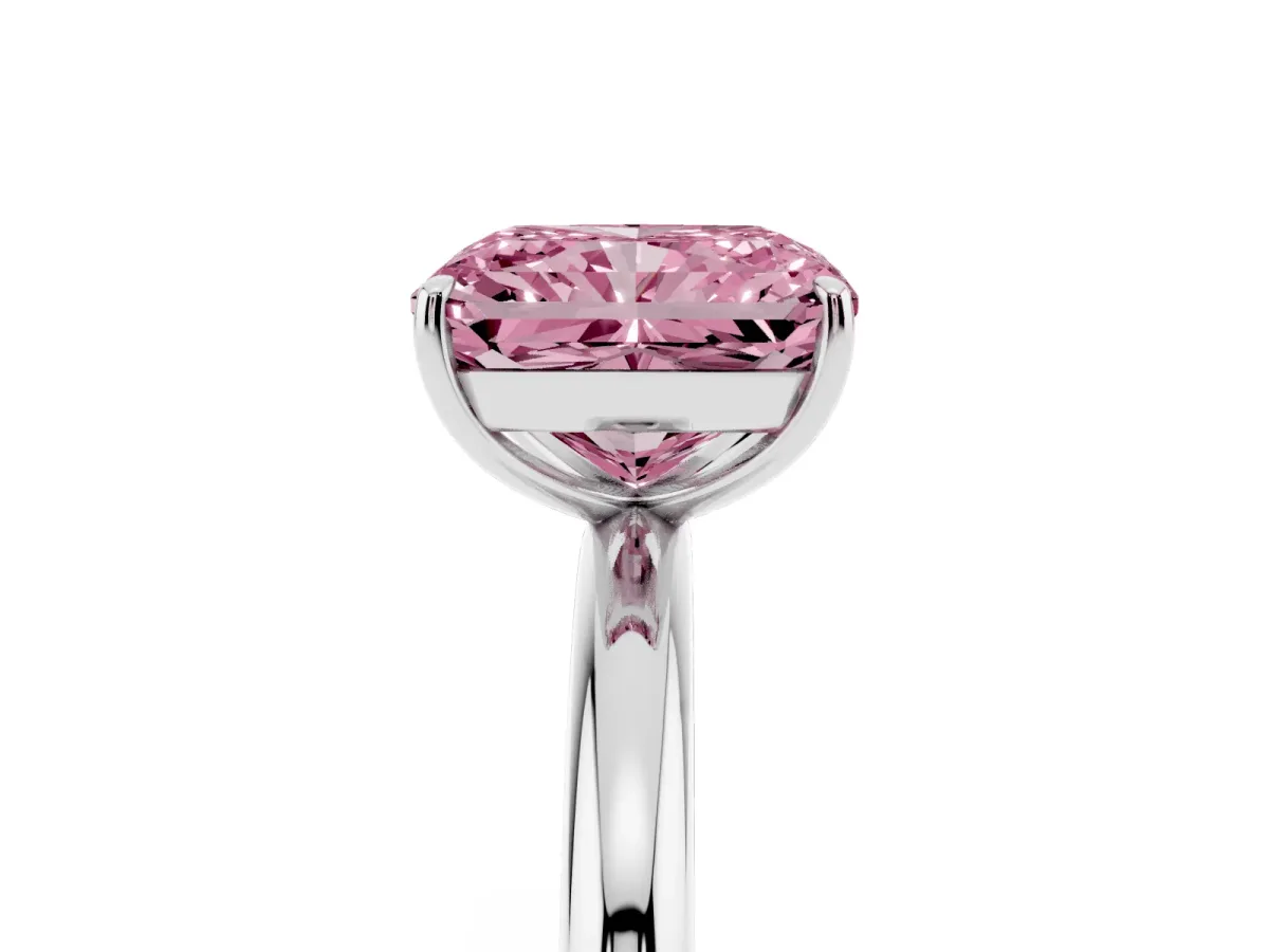Fancy Pink Radiant Cut Solitaire Diamond Ring with Four-Prong Setting on a Plain Band Platinum