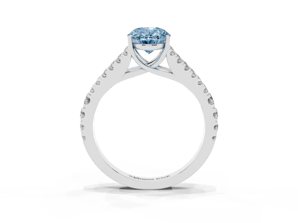 Fancy Blue Oval Cut Diamond Split Shank Pavé Engagement Ring with Four-Prong Setting Silver
