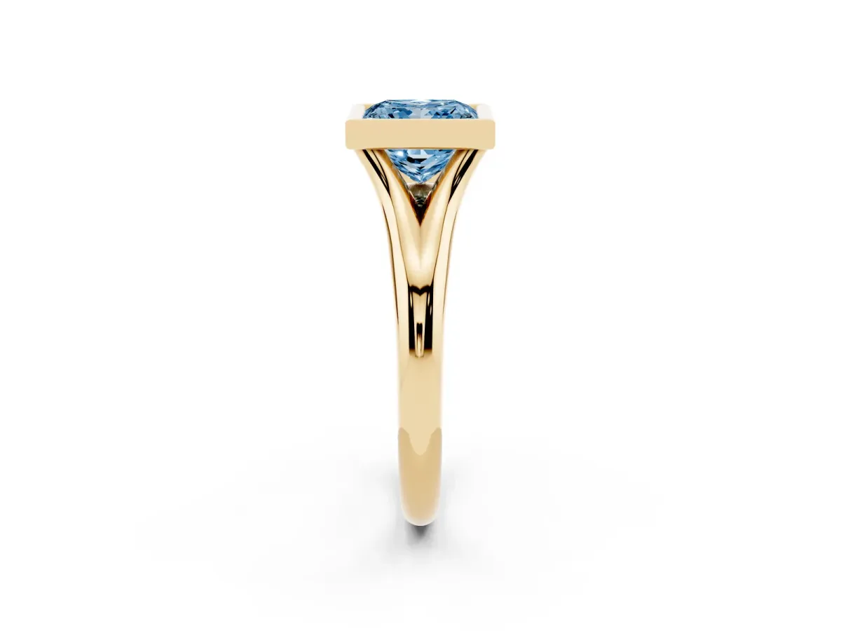 Fancy Blue Bezel Set Princess Cut Solitaire Diamond Ring with Smooth Band Yellow gold