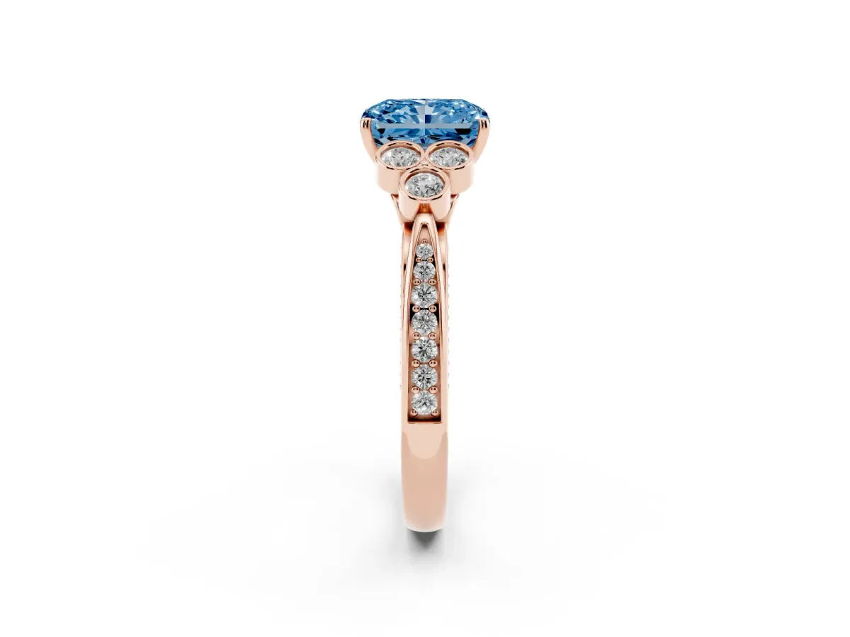 Fancy Blue Radiant Cut Cut Diamond Engagement Ring with Bezel Set Round Side Stones and Prong Setting Rose gold