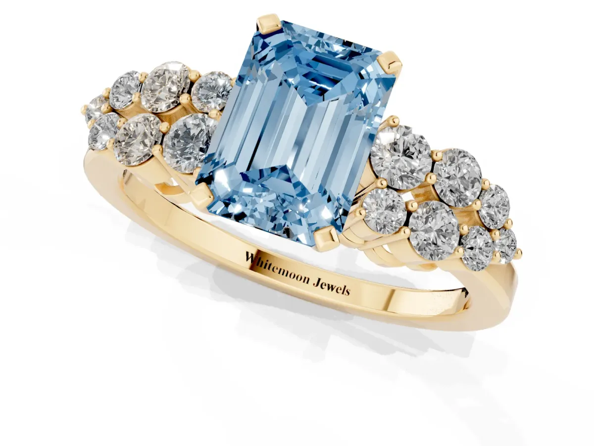 Fancy Blue Emerald Cut Cluster Diamond Engagement Ring with Pavé Band and Four-Prong Setting Yellow gold