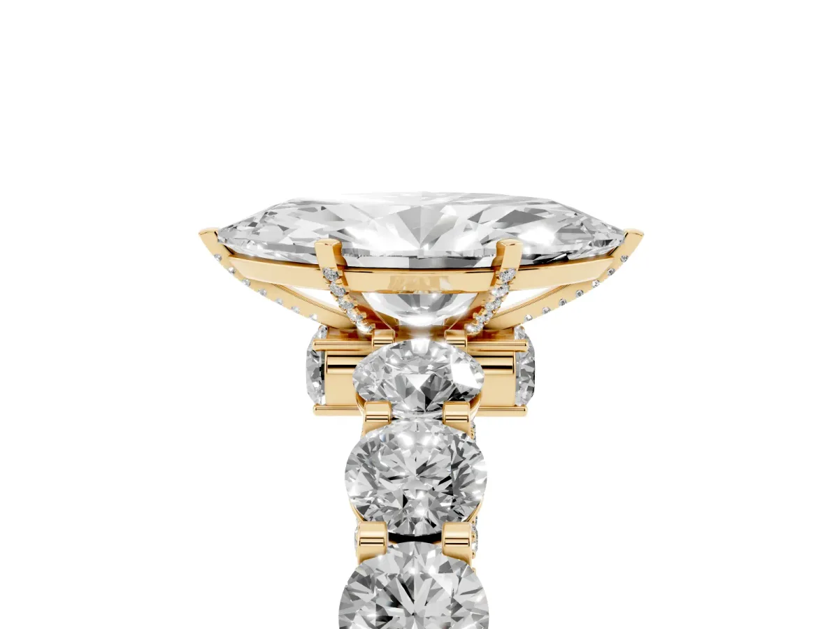Marquise Cut Diamond Side Stone Engagement Ring with Four-Prong Setting Yellow gold