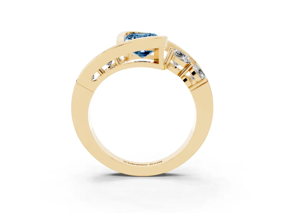 Fancy Blue Bezel Set Emerald Cut Diamond Bypass Ring with Round Accents Yellow gold