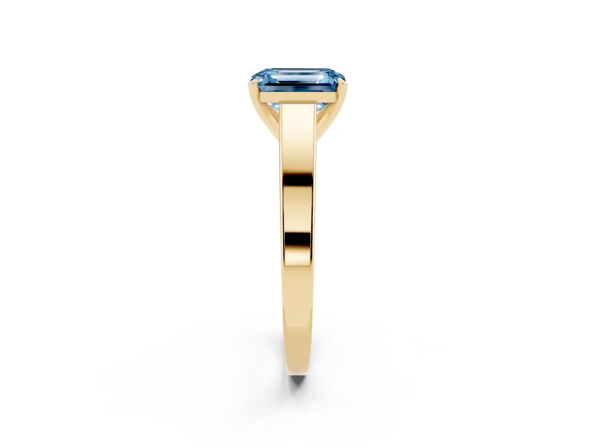Fancy Blue Emerald Cut Solitaire Engagement Ring with Four-Prong Setting and Tapered Band Yellow gold
