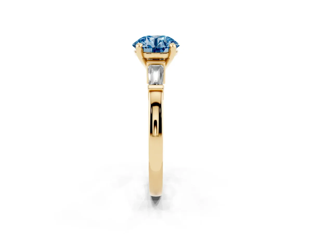 Fancy Blue Round Cut Cut Diamond Solitaire Ring with Tapered Baguette Accents and Four-Prong Setting Yellow gold