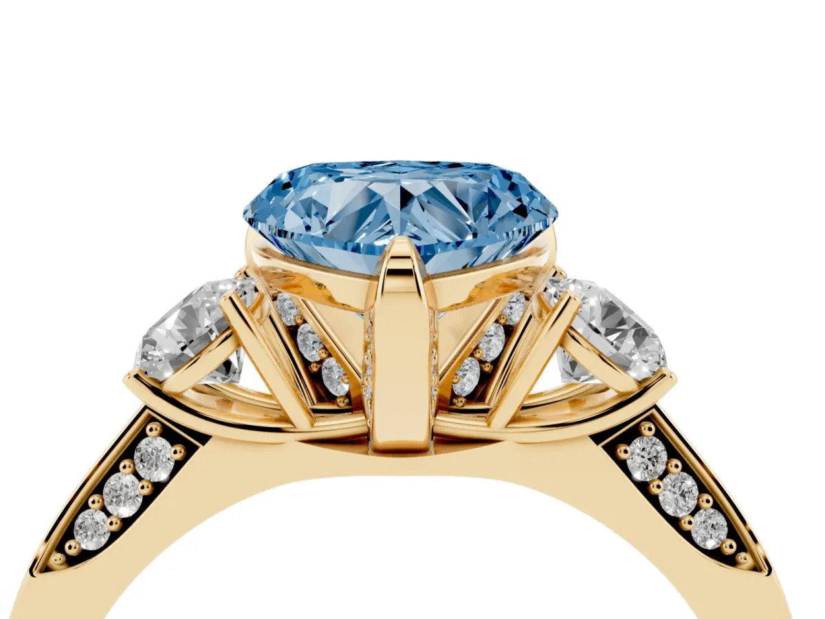 Fancy Blue Heart Cut Brilliant Three-Stone Diamond Ring with Pavé Band and Four-Prong Setting Yellow gold