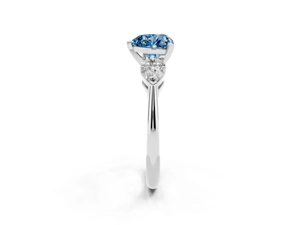 Fancy Blue Three-Stone Heart Cut Diamond Ring with Pear Side Stones and Four-Prong Setting Silver