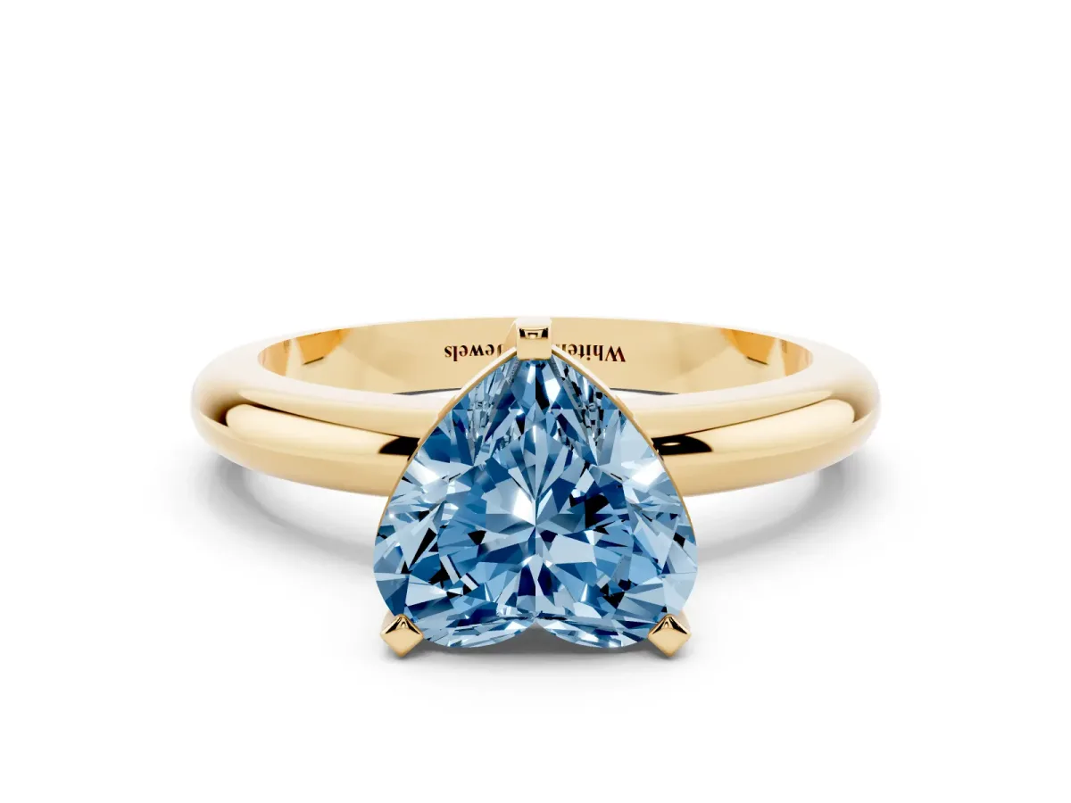 Fancy Blue Heart Cut Diamond Solitaire Engagement Ring with Round Band and Four-Prong Setting Yellow gold