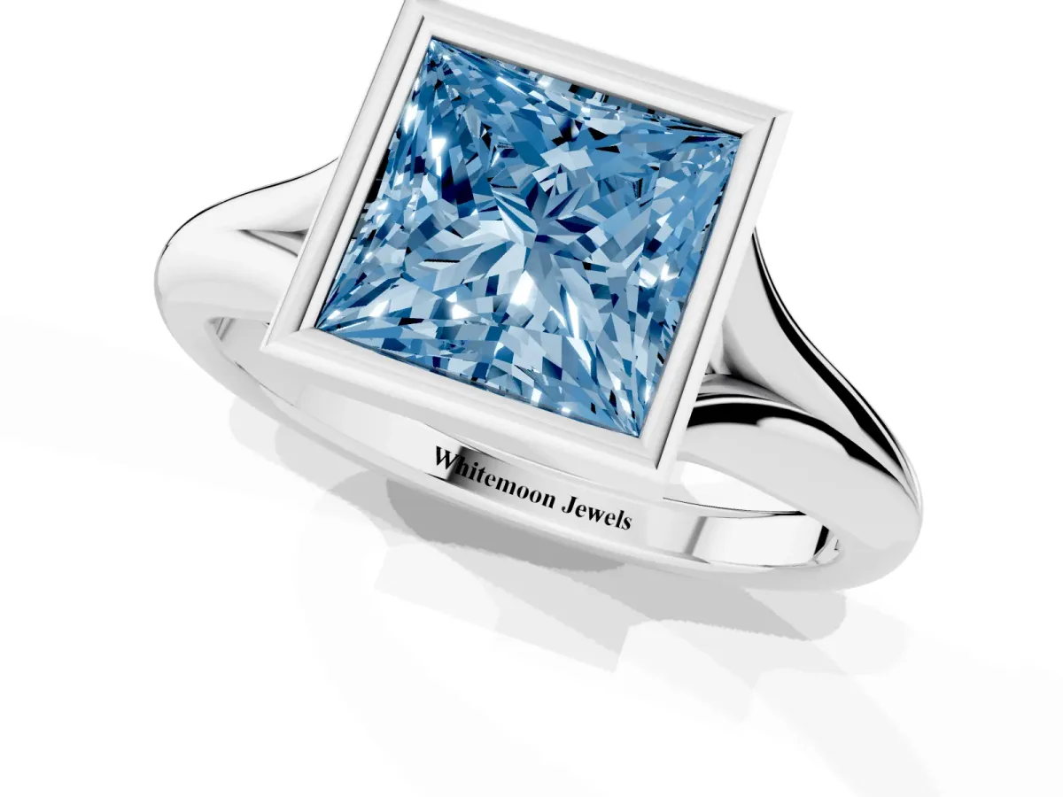 Fancy Blue Bezel Set Princess Cut Solitaire Diamond Ring with Smooth Band Silver