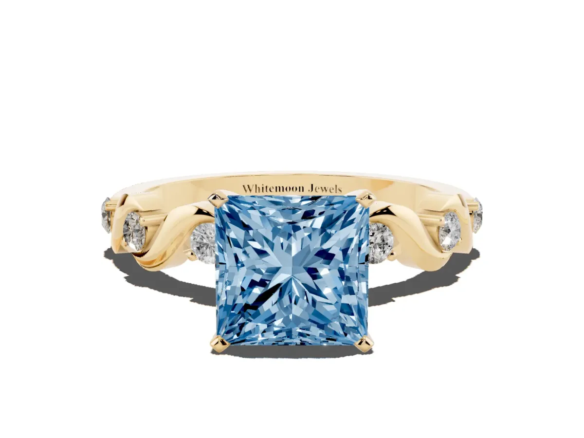 Fancy Blue Princess Cut Diamond Solitaire Twisted Band with Round Accents and Prong Setting Yellow gold