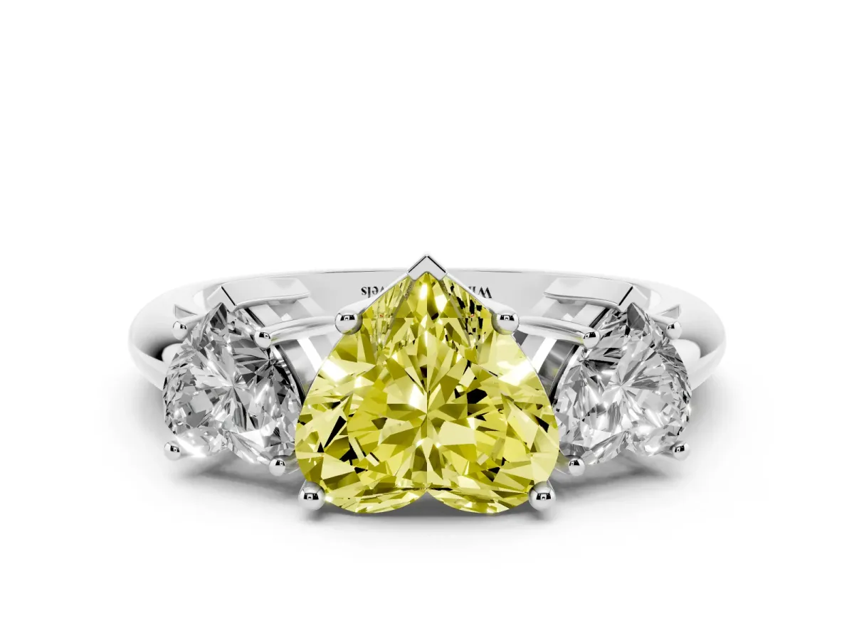 Fancy Yellow Three-Stone Heart Cut Cut Diamond Engagement Ring with Prong Setting on a White Gold Band Silver