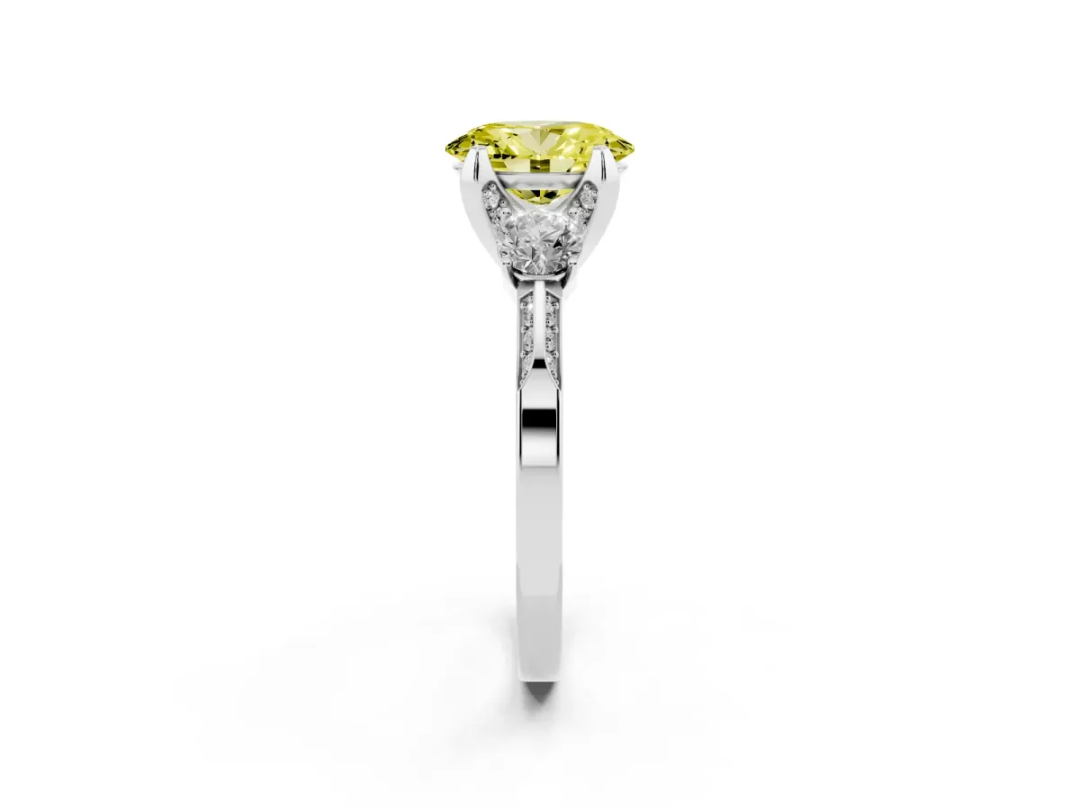 Fancy Yellow Oval Cut Brilliant Three-Stone Diamond Ring with Pavé Band and Four-Prong Setting Silver