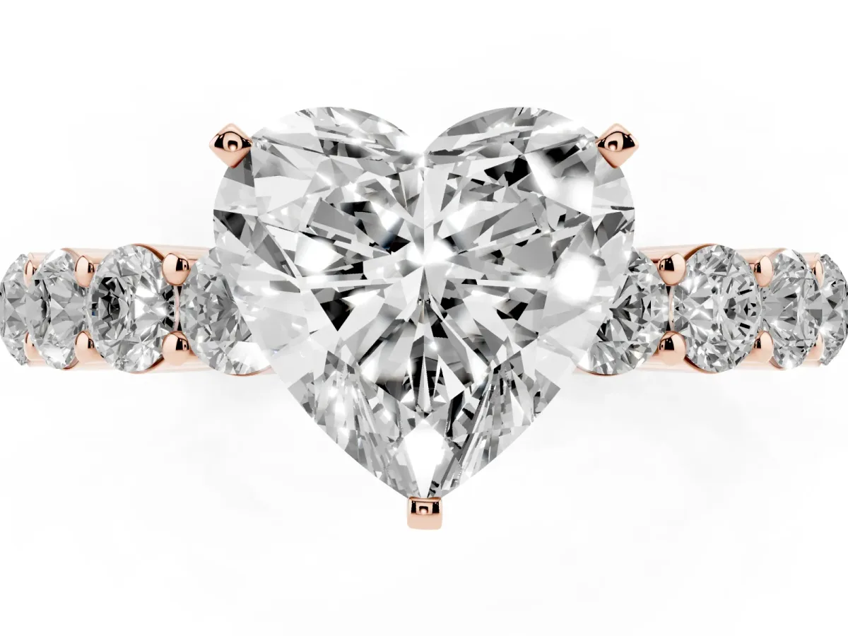 Heart Cut Diamond Solitaire Ring with Shared Prong Round Side Stones Rose gold