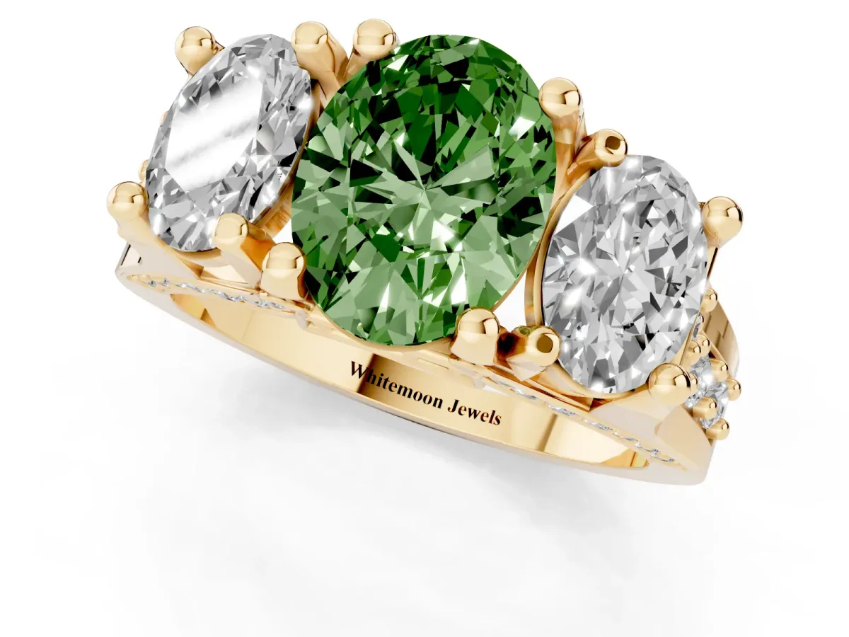 Fancy Green Oval Cut Diamond Three-Stone Ring with Channel Set Band and Four-Prong Setting Yellow gold