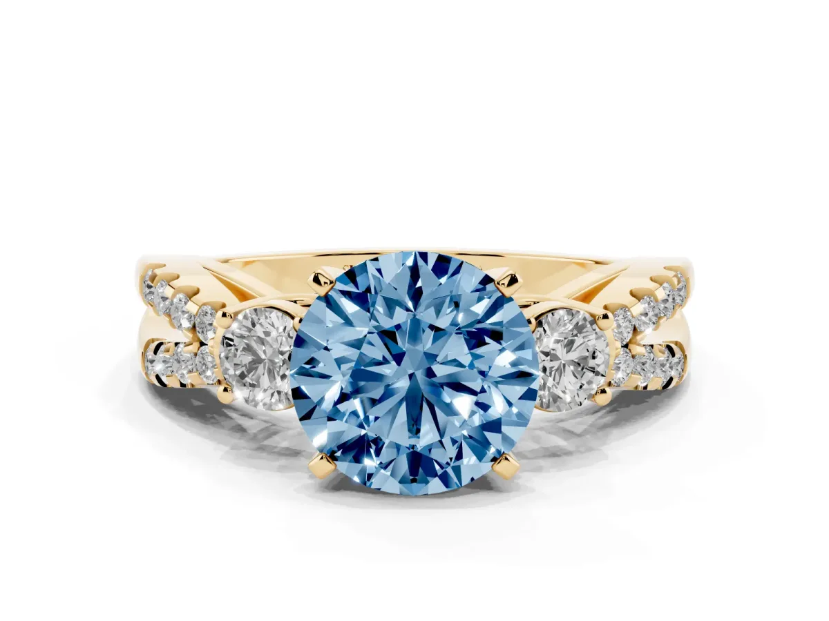 Fancy Blue Round Cut Diamond Three-Stone Ring with Pavé Split Shank and Four-Prong Setting Yellow gold