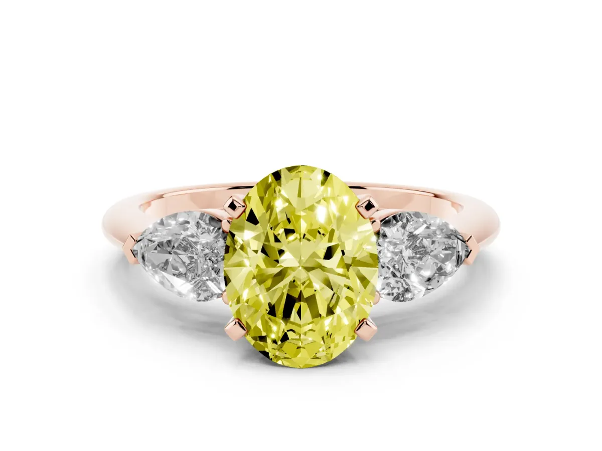 Fancy Yellow Three-Stone Oval Cut Diamond Ring with Pear Side Stones and Four-Prong Setting Rose gold