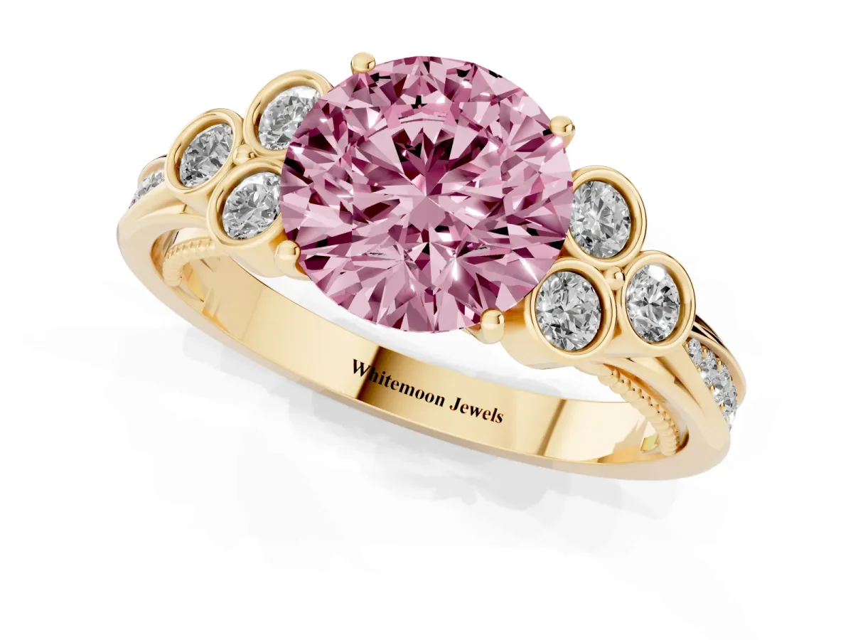 Fancy Pink Round Cut Cut Diamond Engagement Ring with Bezel Set Round Side Stones and Prong Setting Yellow gold