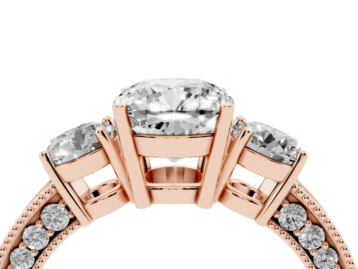Cushion Cut Three-Stone Diamond Ring with Pavé Band and Four-Prong Setting Rose gold