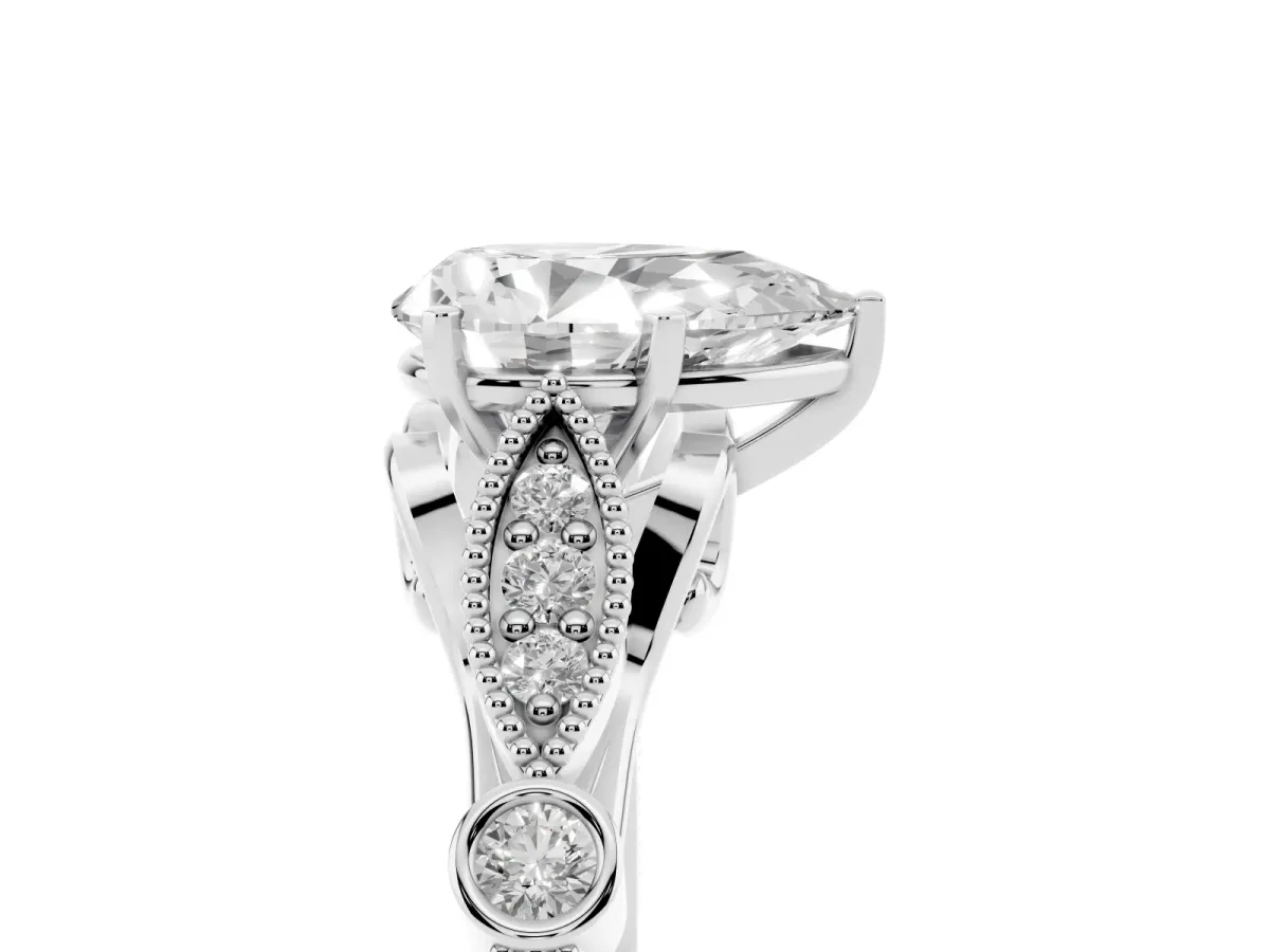 Pear Cut Cut Diamond with Milgrain Marquise and Bezel Accents on a Solitaire Band with Prong Setting Platinum