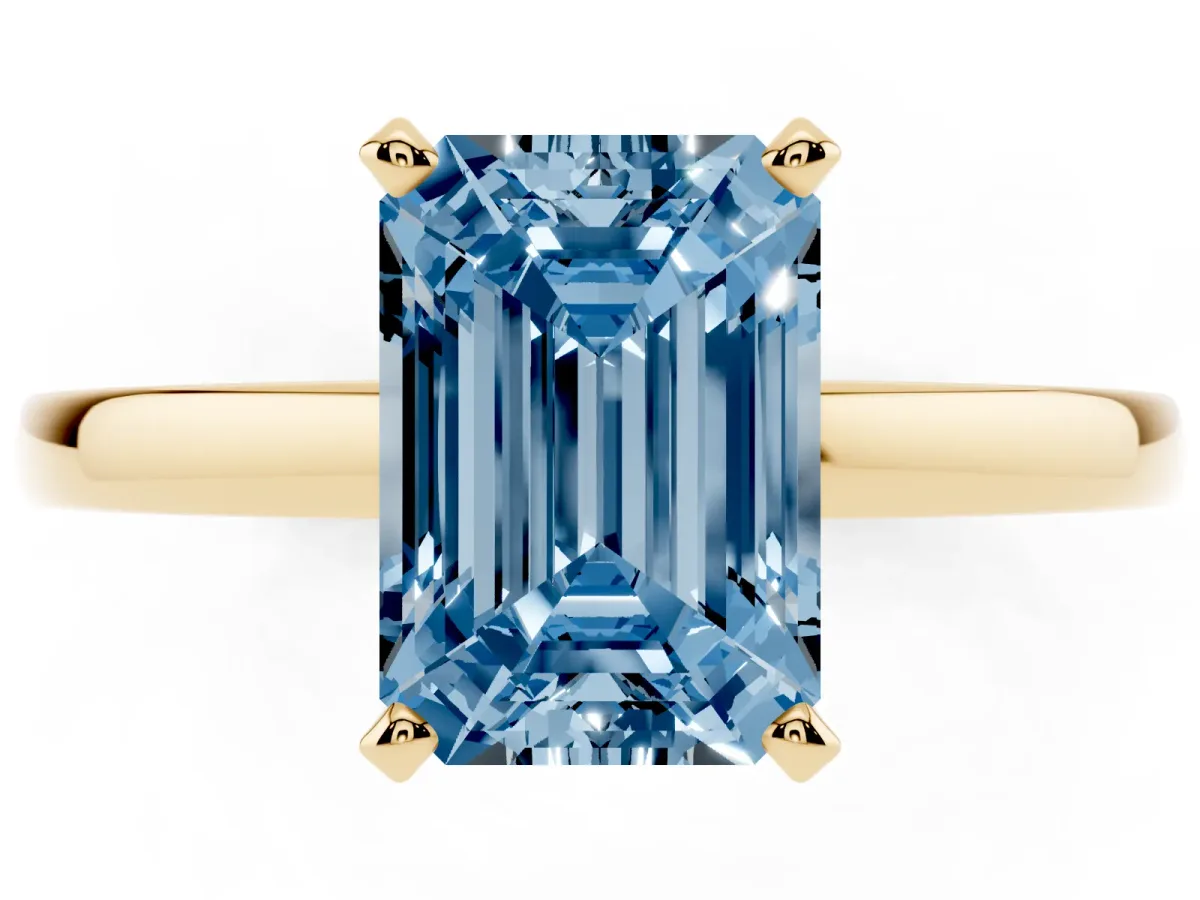 Fancy Blue Emerald Cut Solitaire Diamond Engagement Ring with Four-Prong Setting on a Classic Band Yellow gold
