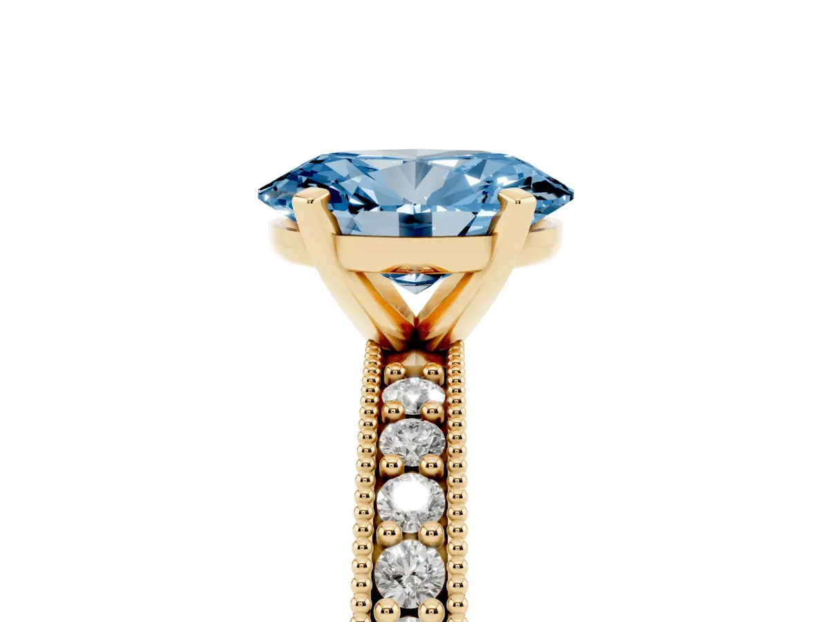 Fancy Blue Oval Cut Diamond Milgrain Pavé Engagement Ring with Four-Prong Setting Yellow gold