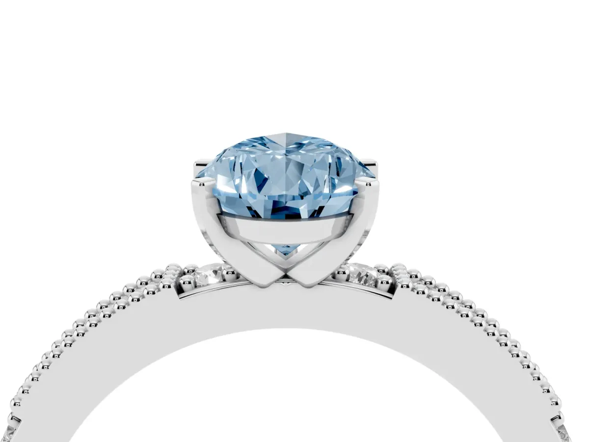 Fancy Blue Pear Cut Solitaire with Pavé Band and Four-Prong Setting Platinum