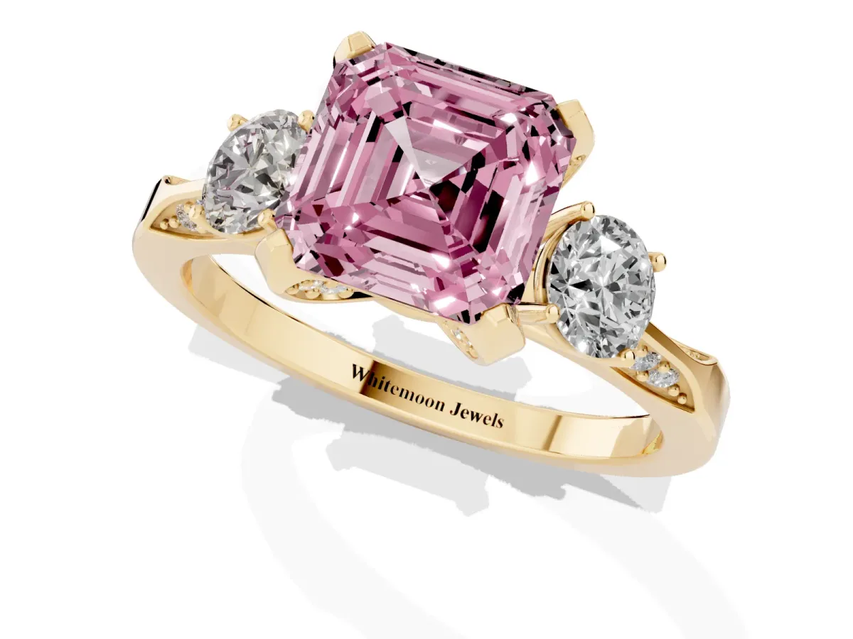 Fancy Pink Asscher Cut Brilliant Three-Stone Diamond Ring with Pavé Band and Four-Prong Setting Yellow gold