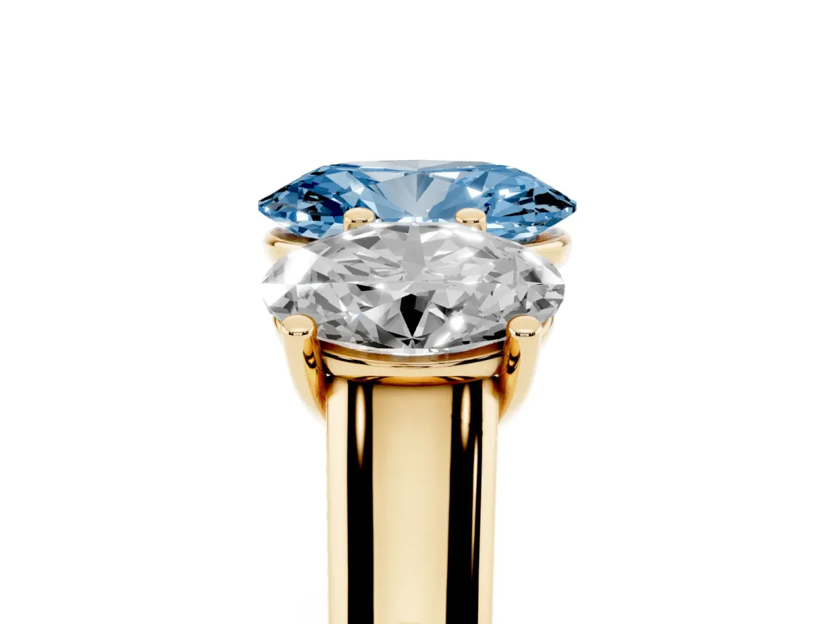 Fancy Blue Oval Cut Three-Stone Diamond Ring with Prong Setting on a Classic Band Yellow gold