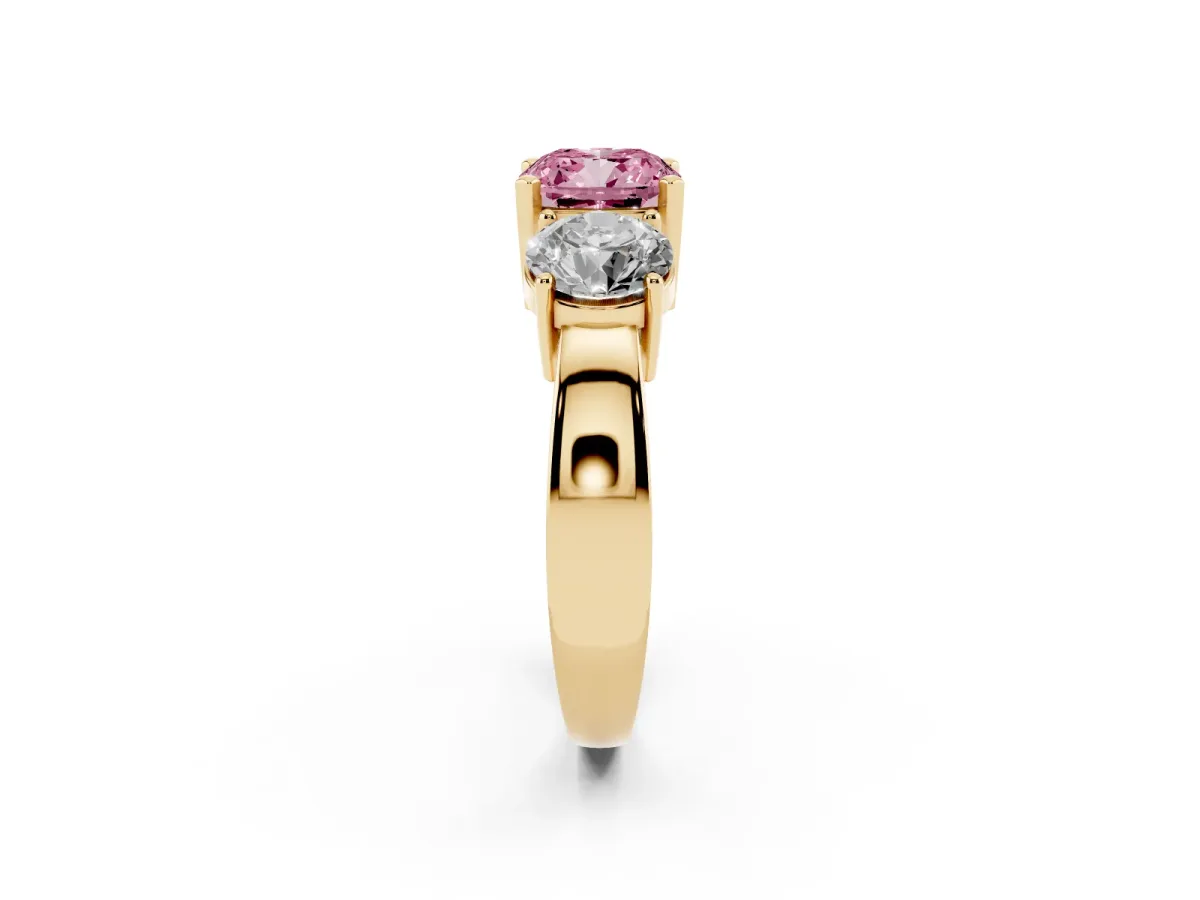 Fancy Pink Three-Stone Cushion Cut Diamond Ring with Round Side Stones, Classic Band, and Four-Prong Setting Yellow gold