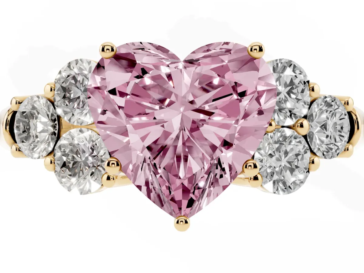 Fancy Pink Heart Cut Cut Diamond Cluster Ring with Round Accent Stones and Prong Setting on a Classic Band Yellow gold