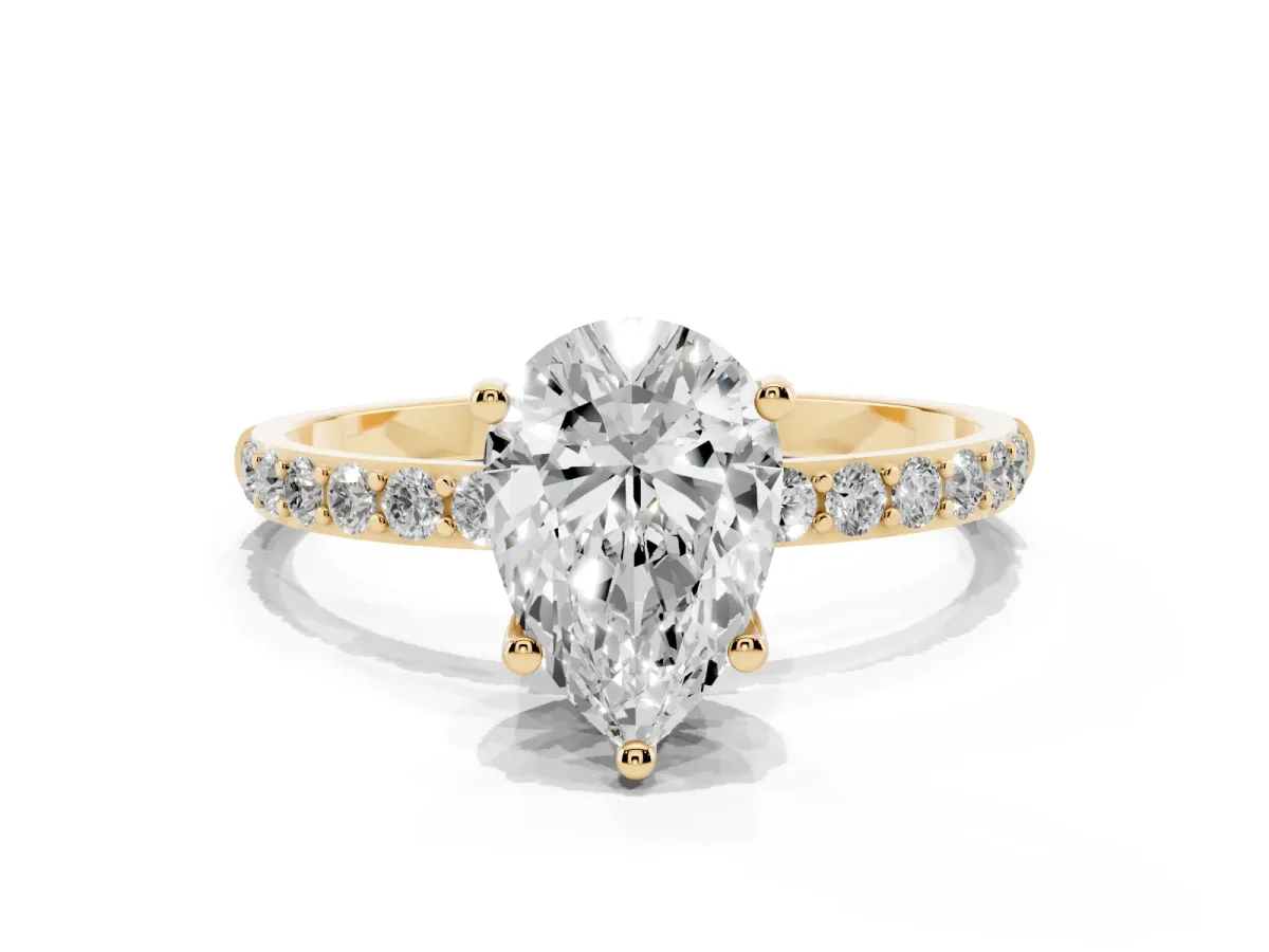 Pear Cut Diamond Solitaire Ring with Round Pavé Shoulders and Prong Setting Yellow gold