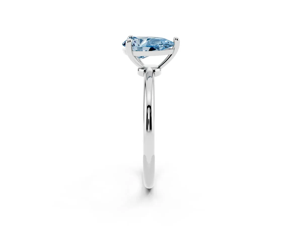 Fancy Blue Pear Cut Solitaire Diamond Ring with 4-Prong Setting on a Classic Band Silver