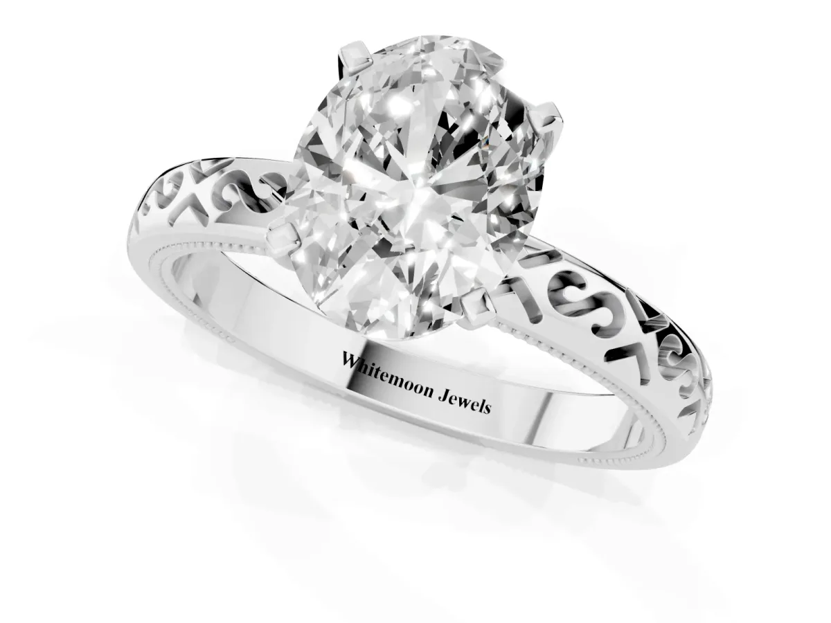 Oval Cut Solitaire Engagement Ring with Scrollwork Band and Four-Prong Setting White gold