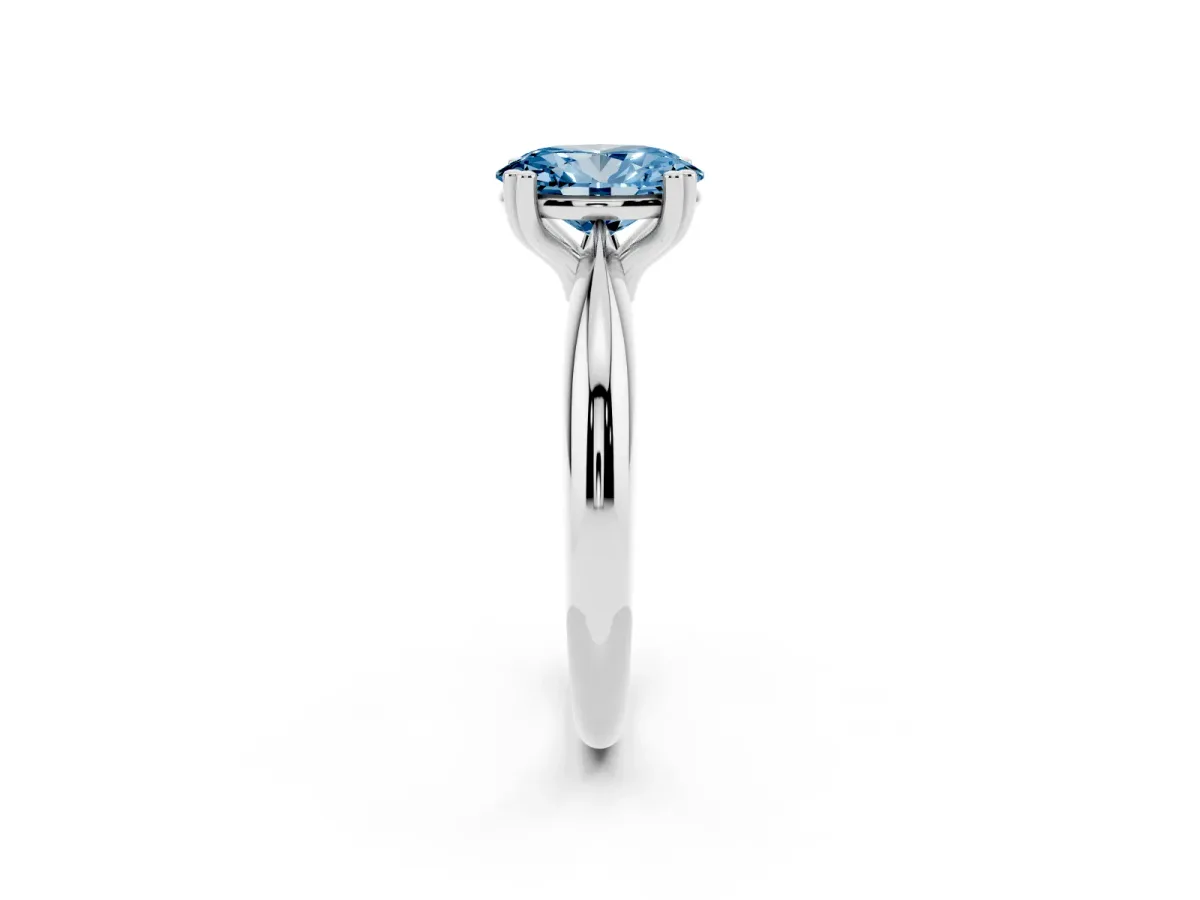 Fancy Blue Oval Cut Cut Solitaire Engagement Ring with Tapered Band and Four-Prong Setting Silver