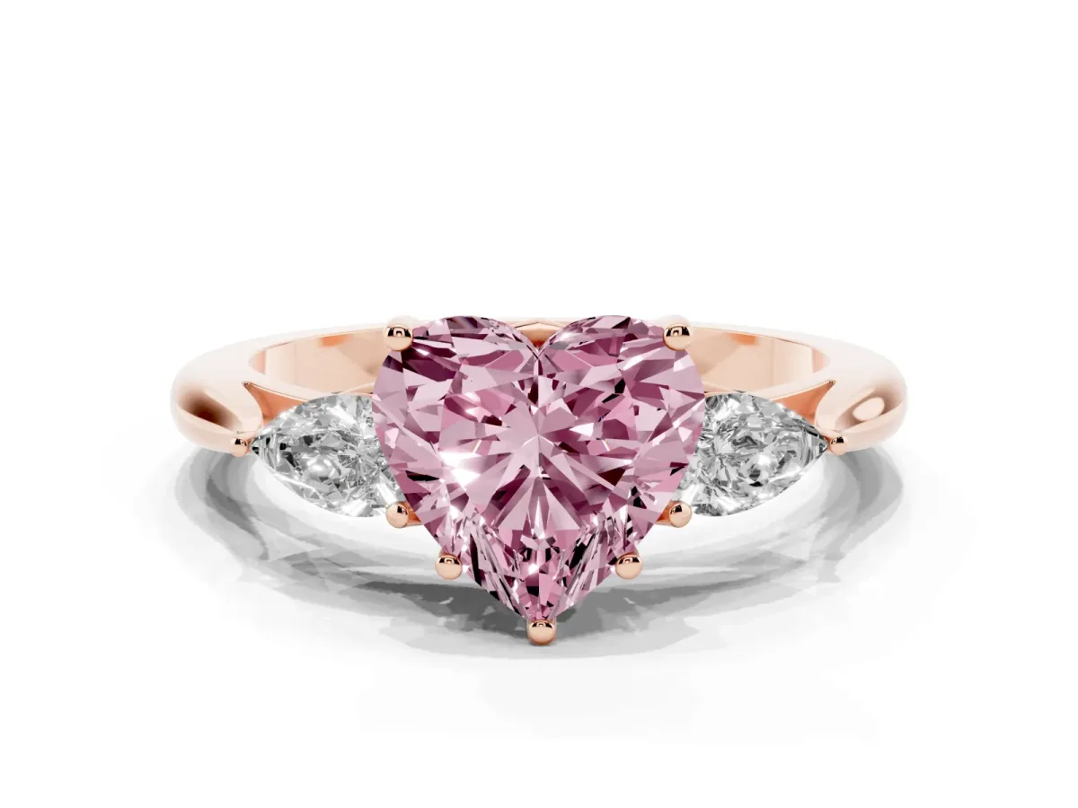 Fancy Pink Three-Stone Heart Cut Brilliant Diamond Solitaire Ring with Tapered Band and Four-Prong Setting Rose gold
