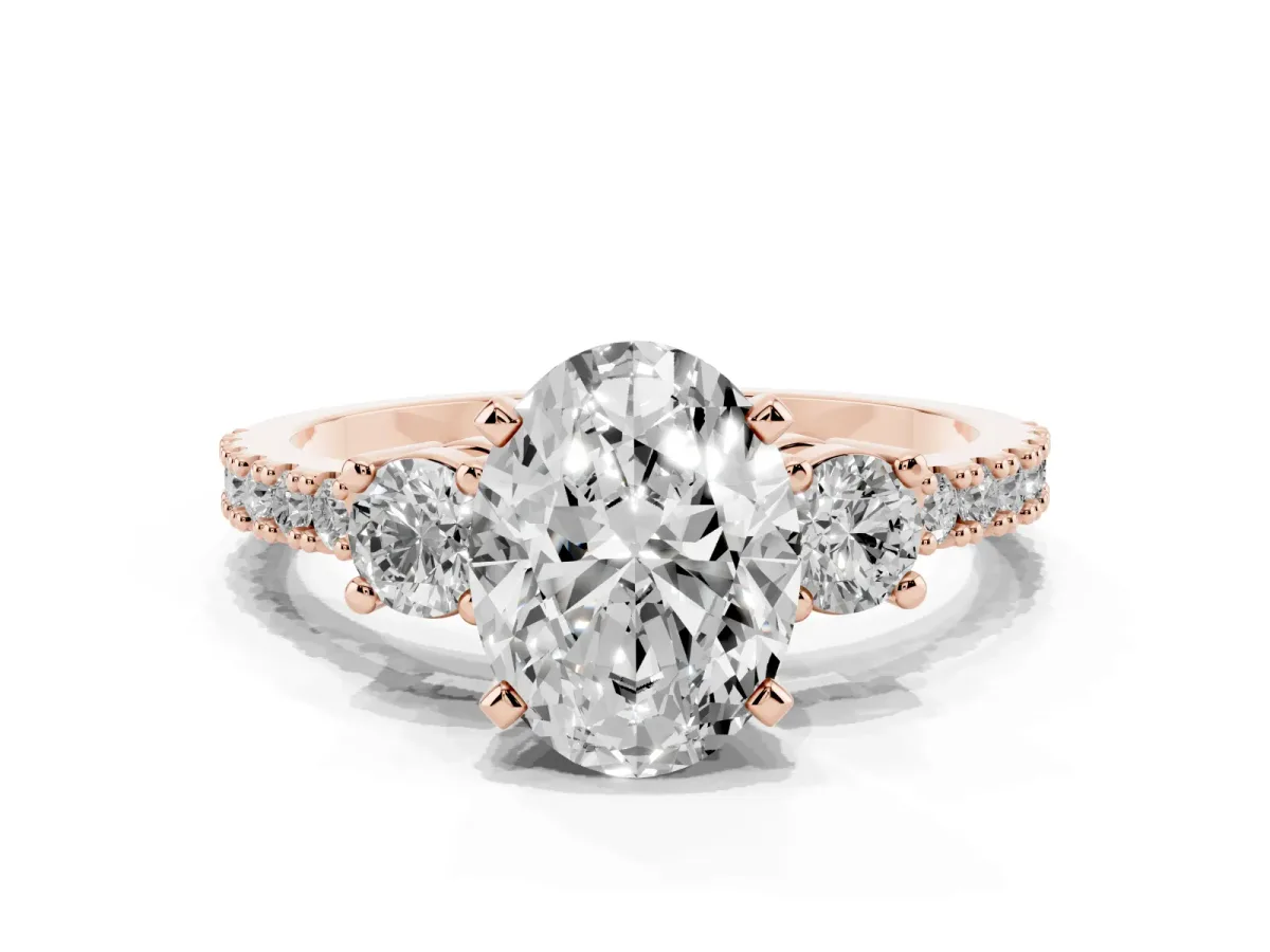 Oval Cut Three-Stone Diamond Pavé Band with Prong Setting Rose gold
